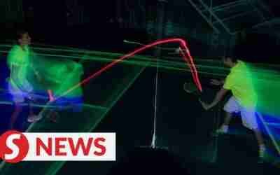 Glow-in-the-dark badminton entices Malaysian players