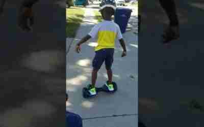 Trying his hoverboard for the first time.